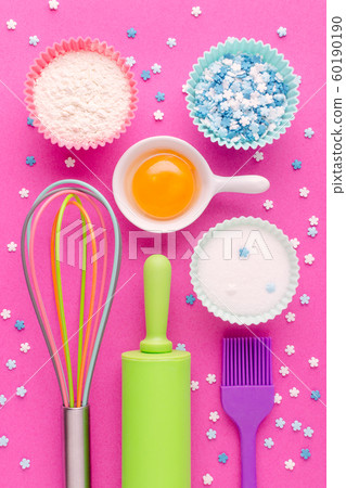 ingredients for baking and kitchen tools on pink background ingredients for baking and kitchen tools on pink background 60190190