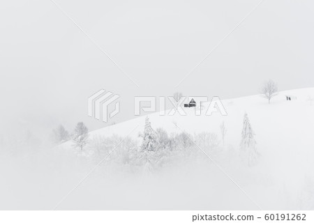 Fantastic landscape with snowy house 60191262