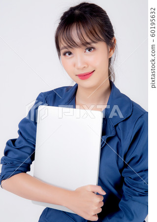 Beautiful portrait young asian business woman holding laptop computer isolated on white background Beautiful portrait young asian business woman holding laptop computer isolated on white background 60195632