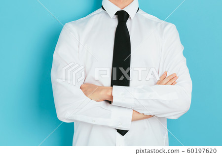 Businessman crossing his arms Businessman crossing his arms 60197620
