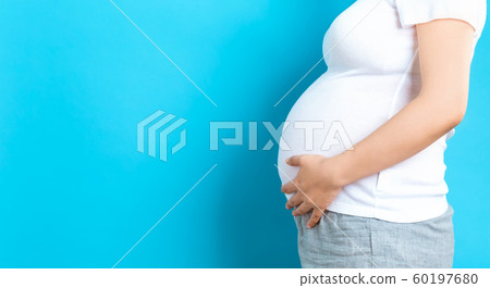 Pregnant woman on a solid background Pregnant woman on a solid background 60197680