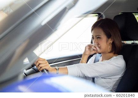 Young Asian woman hold her nose because of bad 60201840