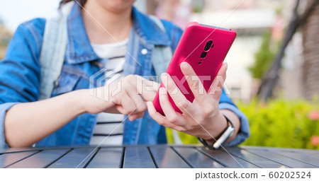 asian woman use smartphone 60202524