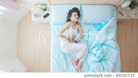 asian woman has stomachache 60202534
