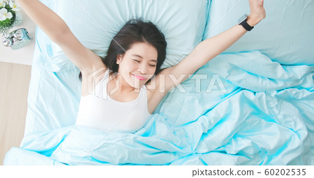 woman sleeping well in bed 60202535