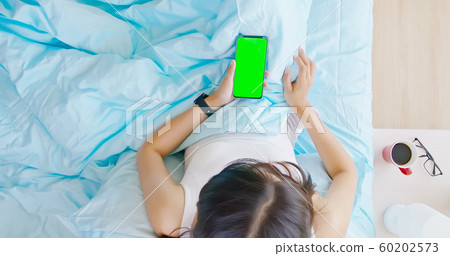 asian woman use smartphone 60202573