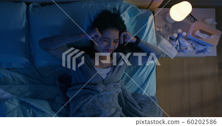 asian woman has headache 60202586