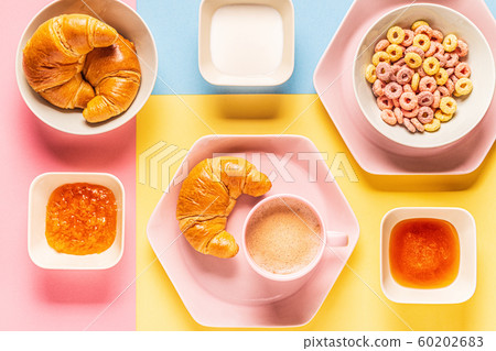 Coffee and croissants on a bright trendy Coffee and croissants on a bright trendy 60202683