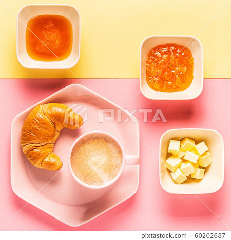 Coffee and croissants on a bright trendy Coffee and croissants on a bright trendy 60202687
