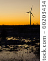 Windmill silhouette in a plain landscape with 60203434
