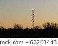 Telecommunication mast by sunset 60203443