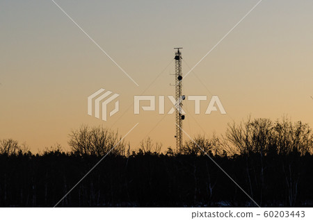 Telecommunication mast by sunset 60203443