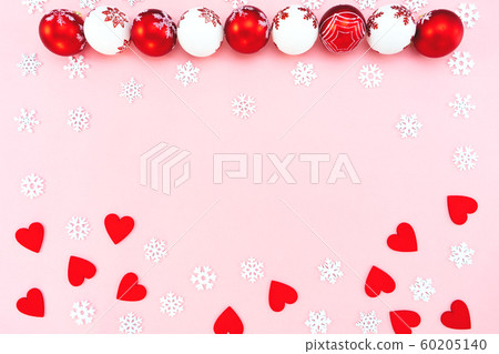 Christmas composition. Christmas balls, red heart and snowflakes decorations on pink background Christmas composition. Christmas balls, red heart and snowflakes decorations on pink background 60205140