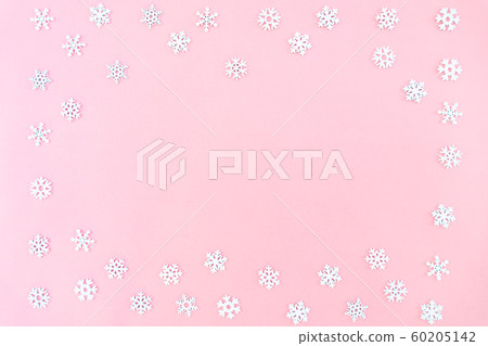 Christmas composition. Christmas snowflakes on pink background. Flat lay, top view, copy space Christmas composition. Christmas snowflakes on pink background. Flat lay, top view, copy space 60205142