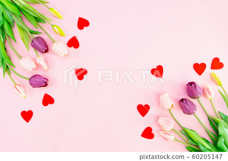 Valentine's Day composition. Tulip flowers and red hearts on pink background. Valentine's day Valentine's Day composition. Tulip flowers and red hearts on pink background. Valentine's day 60205147
