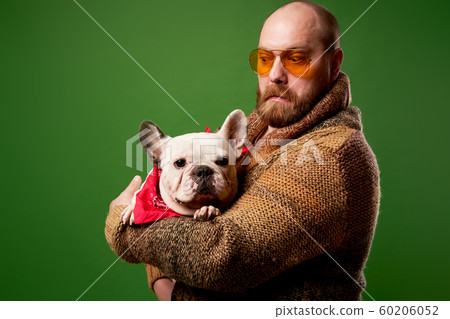 Man in glasses with french bulldog in his arms 60206052