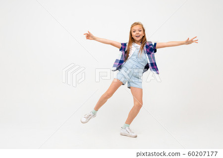 attractive european girl jumping on a white background with copyspace attractive european girl jumping on a white background with copyspace 60207177