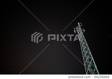 Telephone towers with stars as background at night 60208808