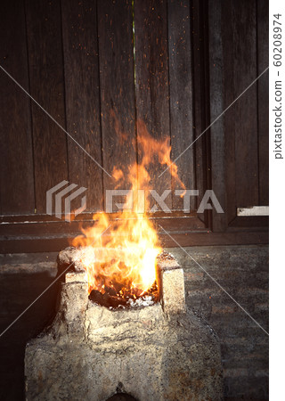 Forged sparks on the fireplace 60208974