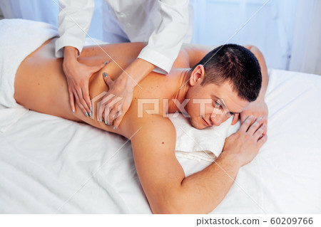 male masseur doing massage back spa health male masseur doing massage back spa health 60209766
