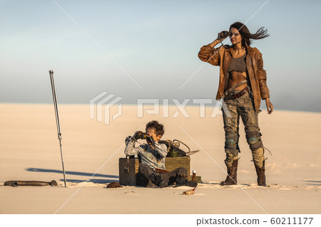 Post apocalyptic Woman and Boy Outdoors in a Wasteland 60211177