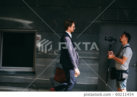 Backstage Of Photo And Video Footage Making With A Male Model Backstage Of Photo And Video Footage Making With A Male Model 60211454