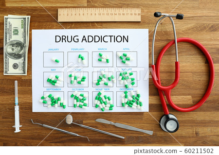 Capsules pharmaceutical tablets lie on calendar with 60211502