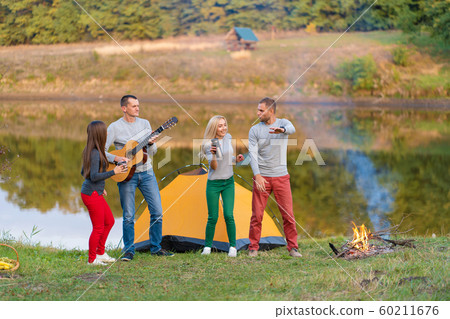 Group of happy friends with guitar, having fun 60211676