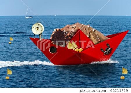 Red paper fishing boat with fishing nets sails in the blue sea Red paper fishing boat with fishing nets sails in the blue sea 60211739