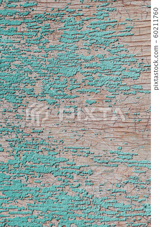 Old and peeling paint Over time, the green paint peeled off from the old boards and the wood texture cracked. Vintage Abstract Grunge Background Old and peeling paint Over time, the green paint peeled off from the old boards and the wood texture cracked. Vintage Abstract Grunge Background 60211760