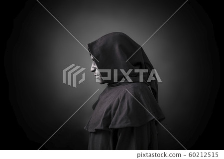 Scary figure in hooded cloak with mask  60212515