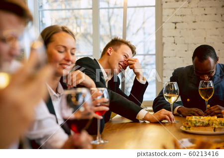 Happy co-workers celebrating while company party and corporate event Happy co-workers celebrating while company party and corporate event 60213416