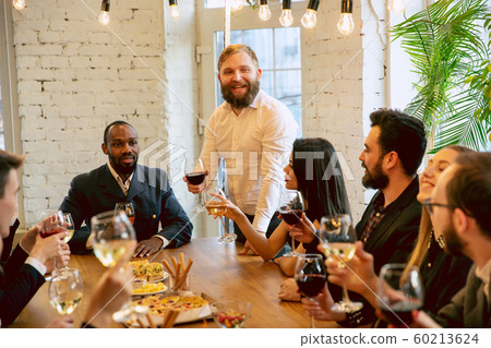 Happy co-workers celebrating while company party and corporate event 60213624