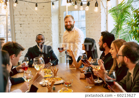 Happy co-workers celebrating while company party and corporate event 60213627