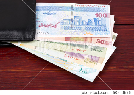 Iranian money - Rial in the black wallet Iranian money - Rial in the black wallet 60213656