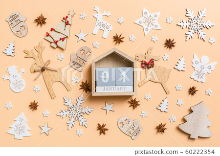 Festive decorations and toys on orange background. Festive decorations and toys on orange background. 60222354