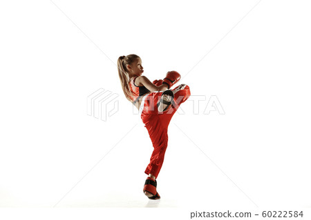 Young female kickboxing fighter training isolated on white background Young female kickboxing fighter training isolated on white background 60222584