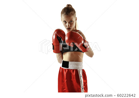 Young female kickboxing fighter training isolated on white background 60222642