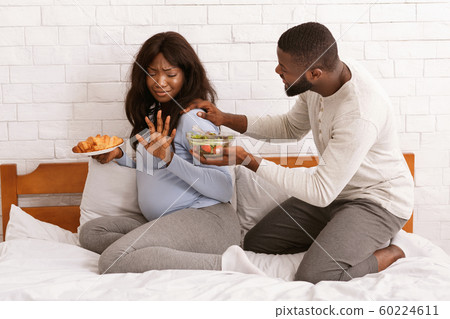 Husband begging his pregnant wife eat healthy food Husband begging his pregnant wife eat healthy food 60224611
