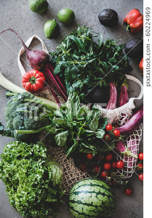 Fresh vegetables, greens and fruits over concrete Fresh vegetables, greens and fruits over concrete 60224969