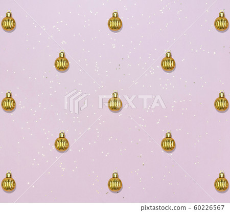 Pattern with golden balls and star confetti on pink pastel background. Christmas or New year card. Pattern with golden balls and star confetti on pink pastel background. Christmas or New year card. 60226567