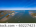 Aerial panorama of boats entering Saint Augustine Inlet in Saint Augustine, Florida 60227423