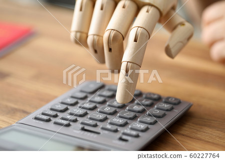 Calculator on wooden desk 60227764
