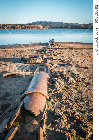Pollution of the environment by waste from pipes or drainage. The concept of nature pollution sewerage. Discharge of toxic or contaminated water into a river or lake. World problem concept. Pollution of the environment by waste from pipes or drainage. The concept of nature pollution sewerage. Discharge of toxic or contaminated water into a river or lake. World problem concept. 60229692