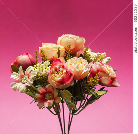 Rustic photo of a bouquet of white and pink peonies flowers on a colored background front view Rustic photo of a bouquet of white and pink peonies flowers on a colored background front view 60231559