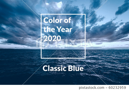 Sunset sea view with dramatic sky and colorful clouds toned in classic blue. 60232959