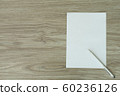 white paper note on wood background 60236126