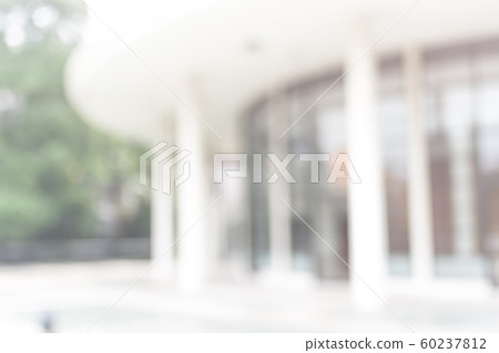 Blur office background building exterior view to lobby glass window wall with blurry light bokeh Blur office background building exterior view to lobby glass window wall with blurry light bokeh 60237812