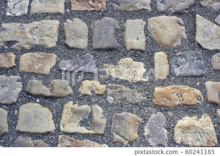 Paving stones road with gravel 60241185