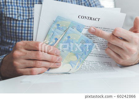 Man holding money and contract gesture middle finger. 60242866